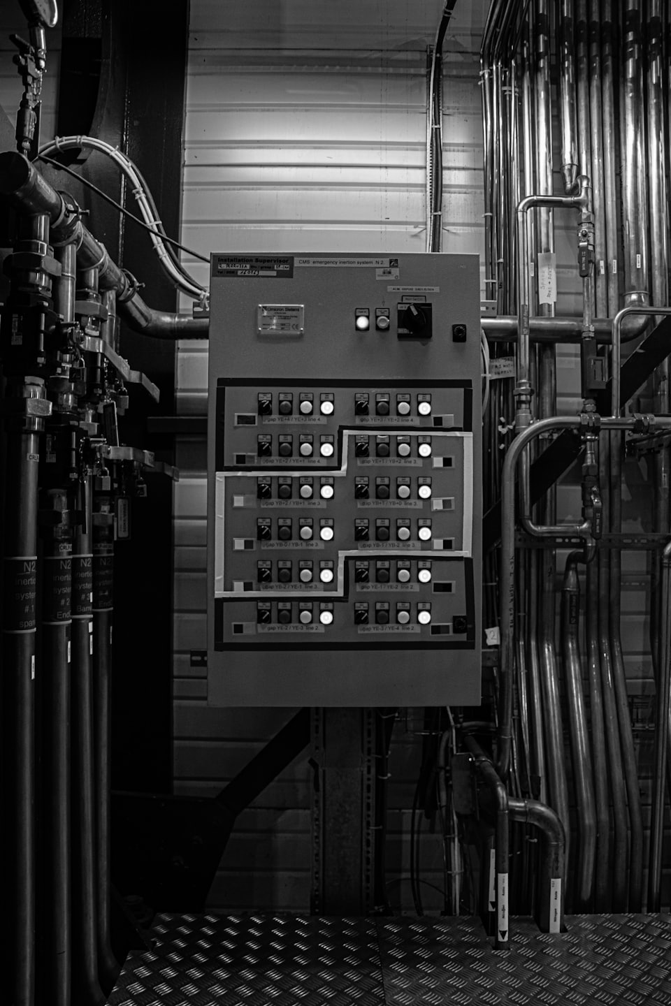 Control panel with glowing lights in a factory.